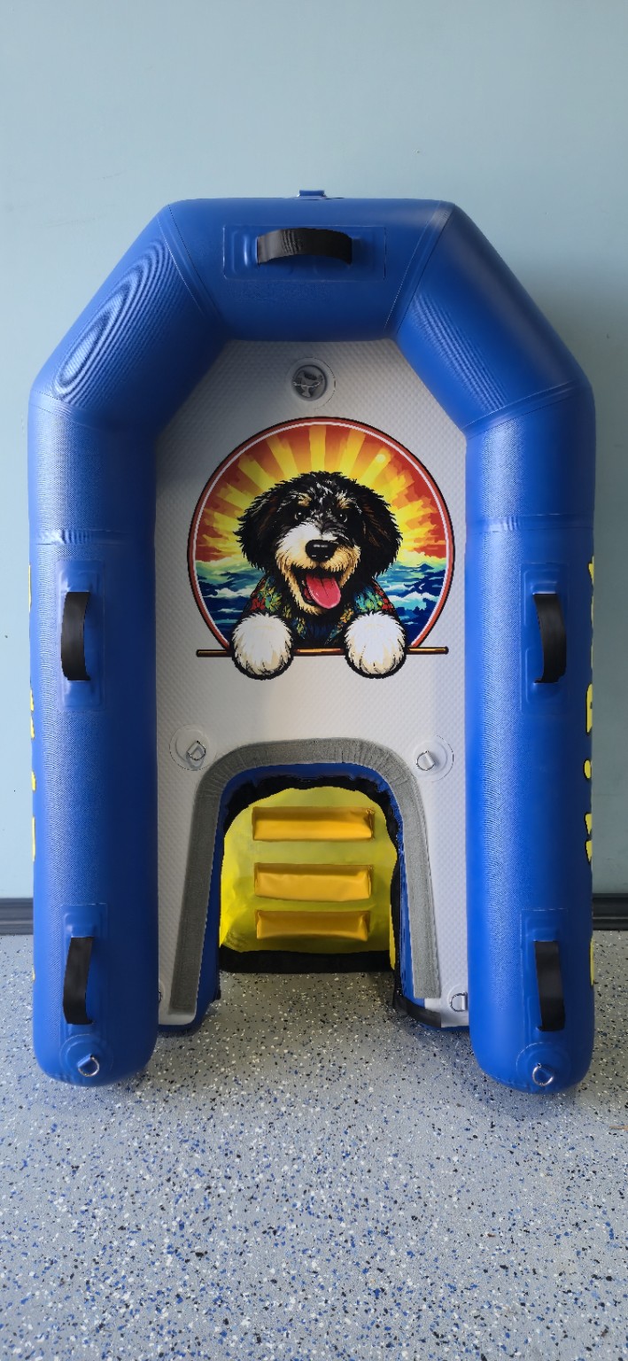Top view of Bodhi Boat with the yellow swimming ladder deployed so dogs can climb back aboard from the water